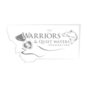 Logo for Warriors & Quiet Waters Foundation featuring a map outline of Montana, a leaping fish, a military helmet, and two hands holding a heart—symbols representing the spirit of Montana’s land for sale and recreational land—with the foundation’s name in bold letters.