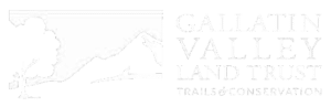 White logo with an outline of a tree, hills, and a winding trail—evoking recreational land—on the left, and the words “Gallatin Valley Land Trust Trails & Conservation” in all caps on the right.