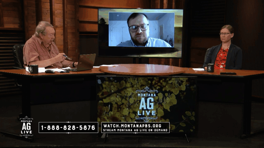 Three people appear on a Montana AG Live TV show set: one man sits at a desk with a laptop, another joins via video call on a large screen, and a woman sits across the desk; hunting property details are displayed onscreen.